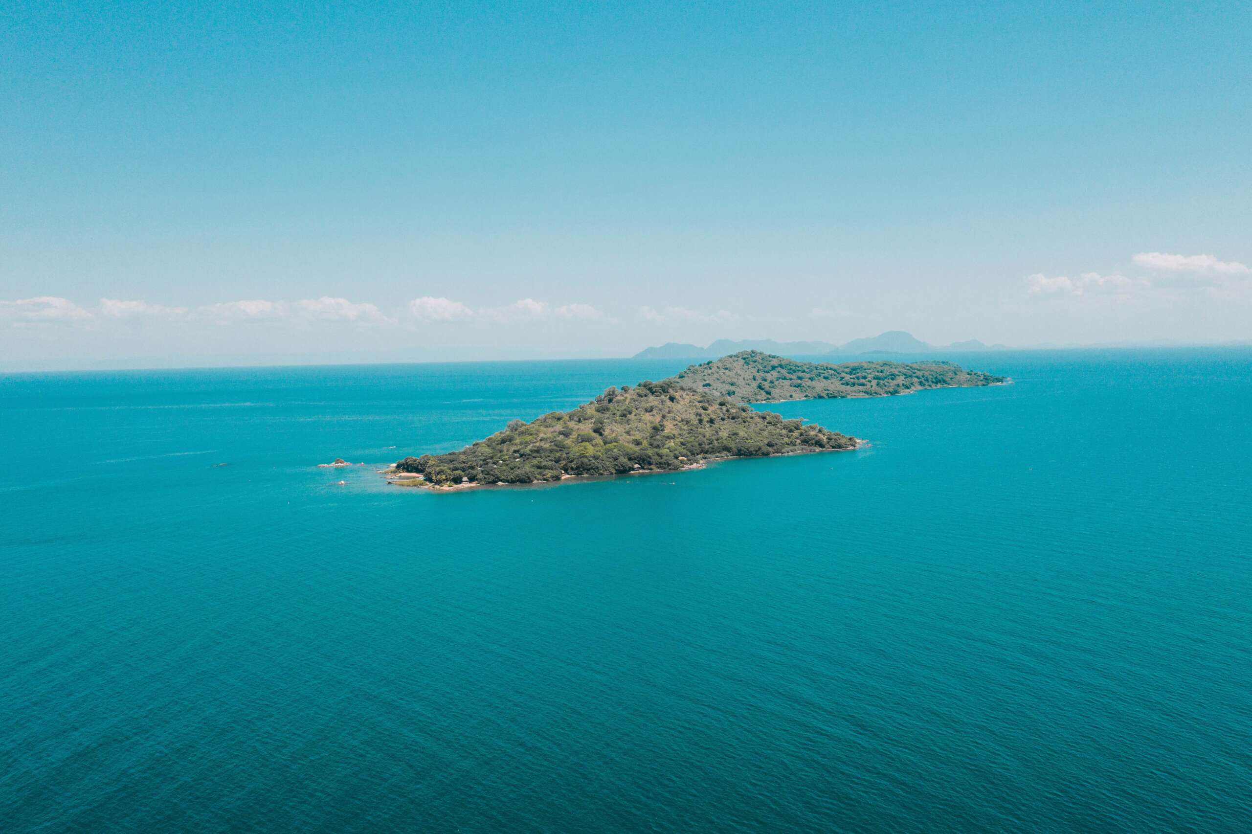 https://visitmalawi.mw/wp-content/uploads/2022/01/Lake-Malawi-Blue-Zebra-islands-scaled.jpg